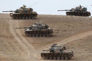 Turkish-army-tanks-take-up-position-on-the-Turkish-Syrian-border-near-Suruc